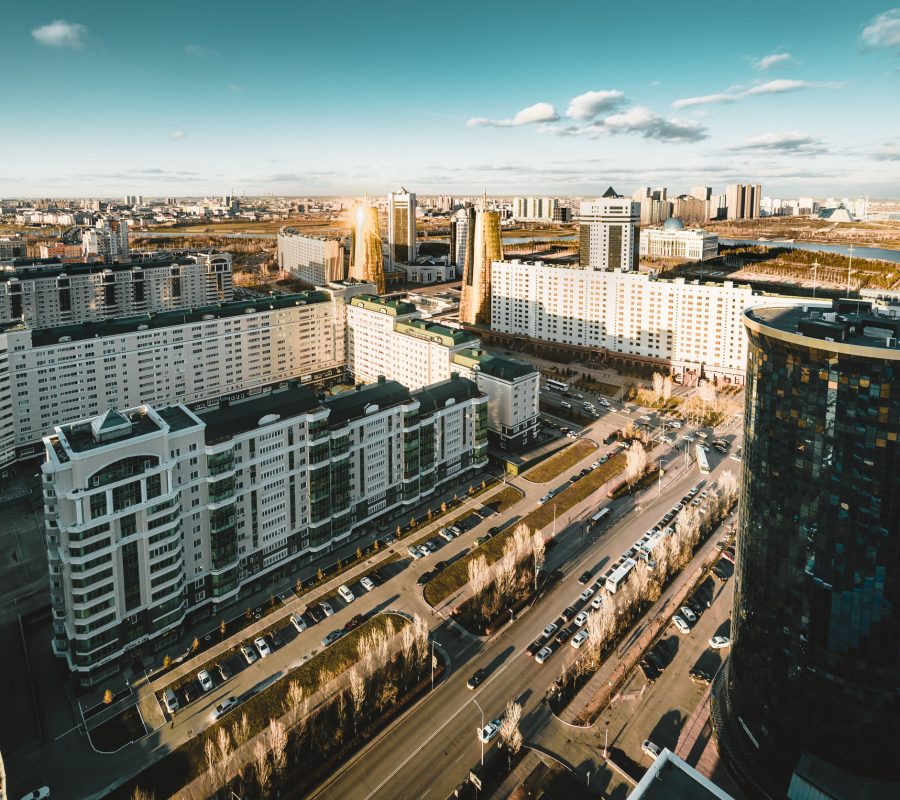 Sunset view towards Bayterek tower and hous of ministries in Astana Kazakhstan on a clear day. Photo taken in Kazakhstan Astana.